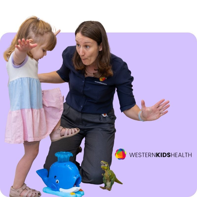 Nicole Pates playing with child